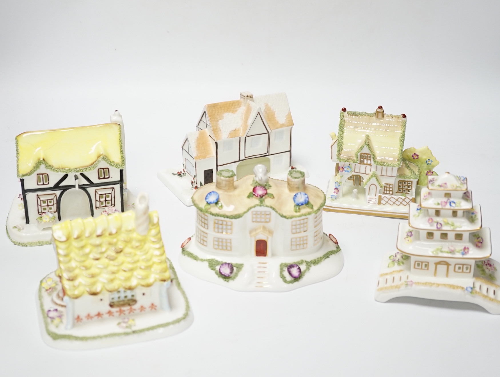 A collection of Eleven Coalport models of architectural and historic houses